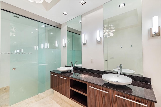 bathroom with vanity and a shower