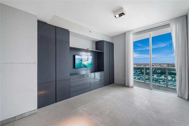 unfurnished living room featuring expansive windows