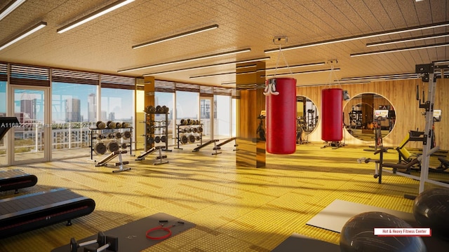 workout area featuring wood walls