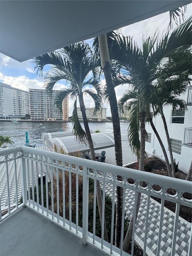 balcony featuring a water view