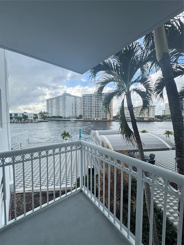 balcony featuring a water view