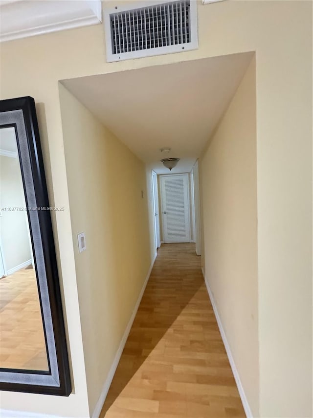 hallway featuring light hardwood / wood-style flooring