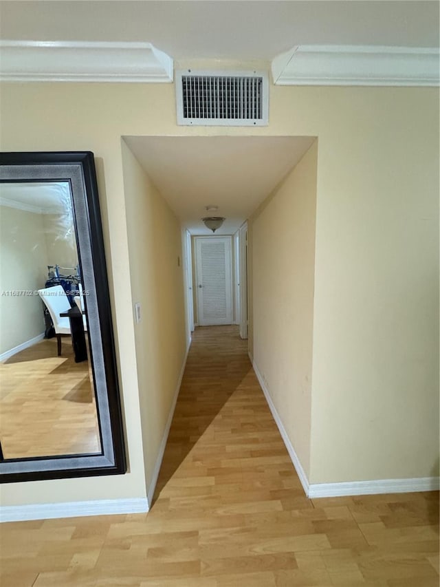 corridor with light hardwood / wood-style flooring