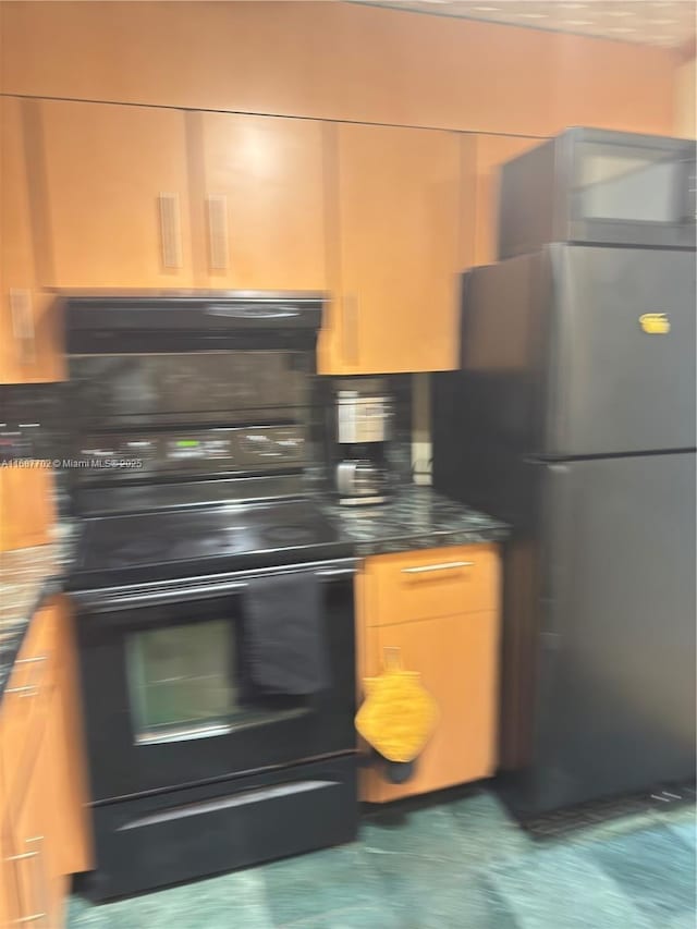 kitchen with stainless steel fridge and backsplash