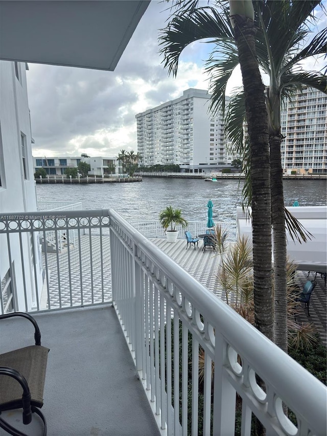 balcony featuring a water view