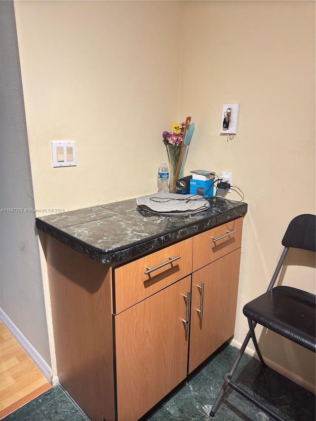 interior space with dark stone counters