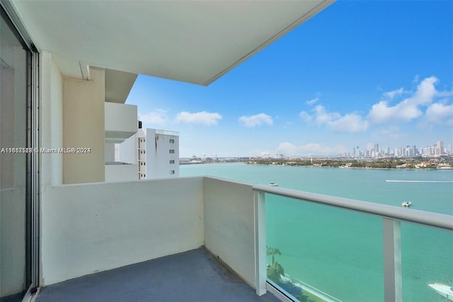 balcony featuring a water view