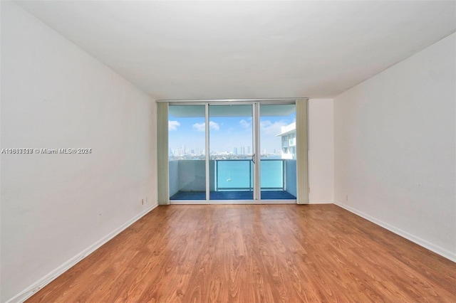 spare room featuring light hardwood / wood-style floors