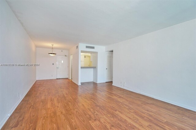 unfurnished living room featuring light hardwood / wood-style flooring