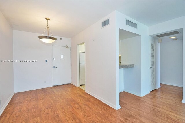 spare room featuring light wood-type flooring