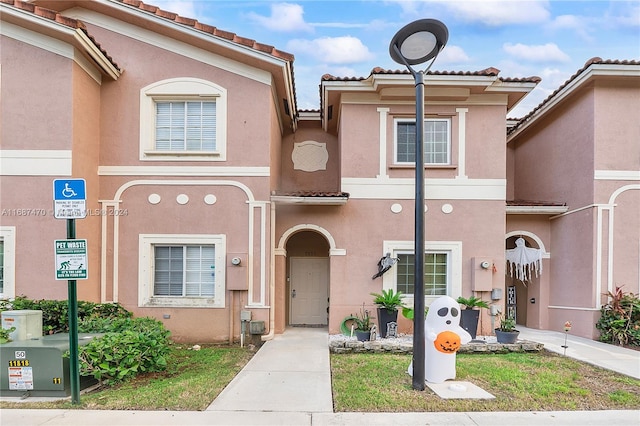 7859 Catalina Cir Unit 7859, Tamarac, FL 33321 - view of front of property featuring a tile roof and stucco siding