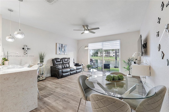 dining space featuring hardwood / wood-style flooring and ceiling fan