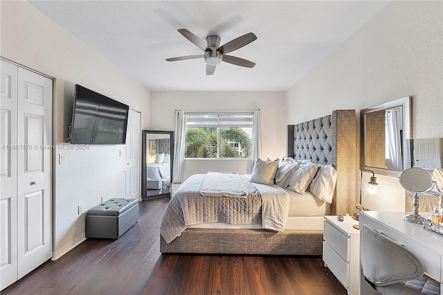 bedroom with a closet, dark hardwood / wood-style floors, and ceiling fan