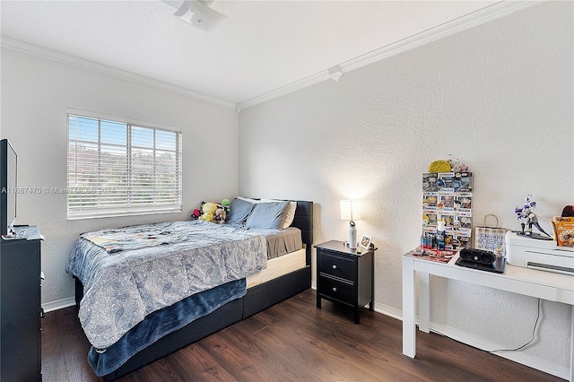 bedroom featuring crown molding and dark hardwood / wood-style flooring