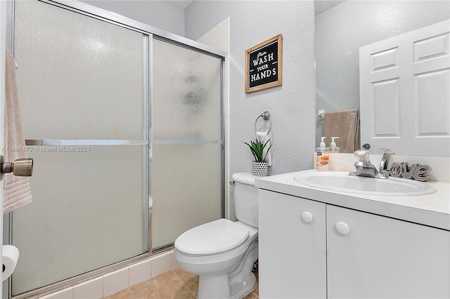 7859 Catalina Cir Unit 7859, Tamarac, FL 33321 - full bath featuring toilet, a shower stall, tile patterned flooring, vanity, and a textured wall