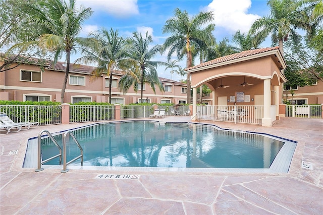 view of pool featuring a patio area and ceiling fan