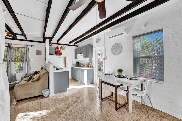 dining room featuring ceiling fan, light tile patterned floors, a wall mounted AC, and beam ceiling