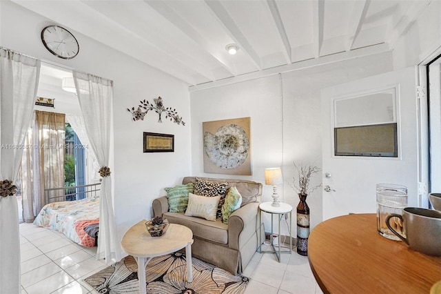 living room featuring light tile patterned flooring and beamed ceiling