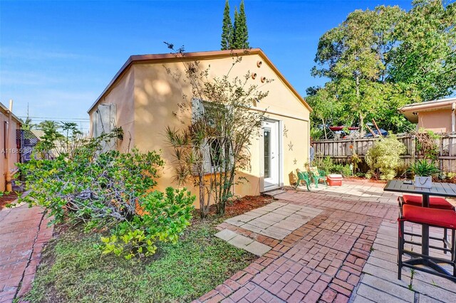 rear view of house featuring a patio