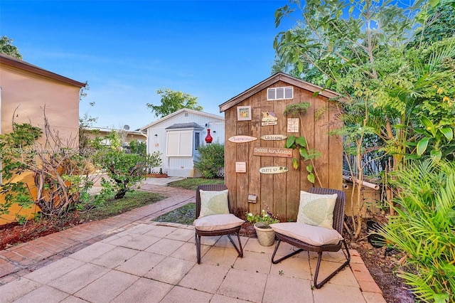 view of patio / terrace featuring a storage unit