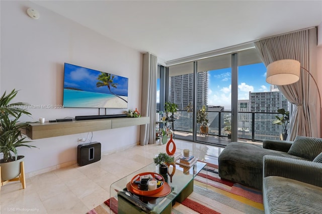 living room featuring a wall of windows