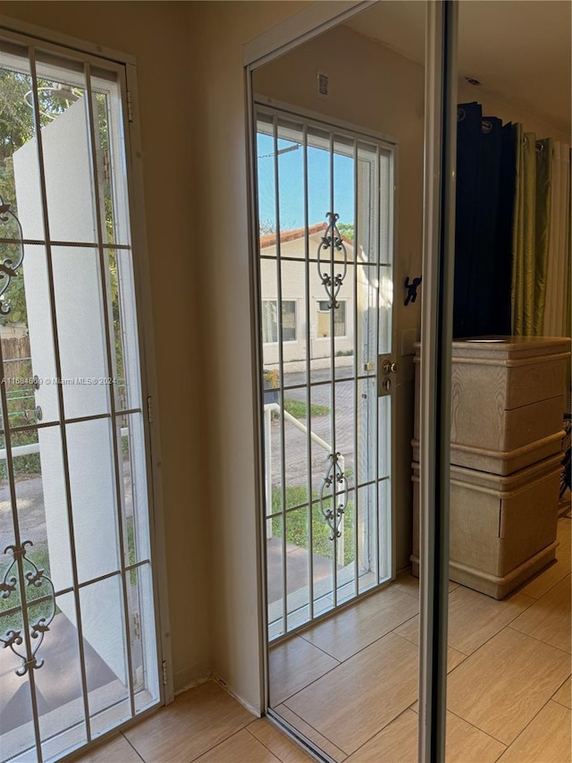 doorway to outside with light hardwood / wood-style flooring