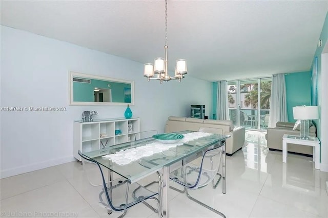 dining area with a notable chandelier and light tile patterned flooring