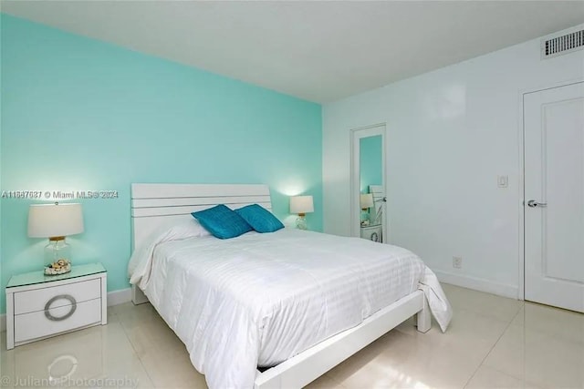 bedroom with light tile patterned flooring