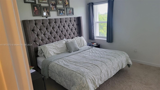 bedroom featuring carpet and multiple windows