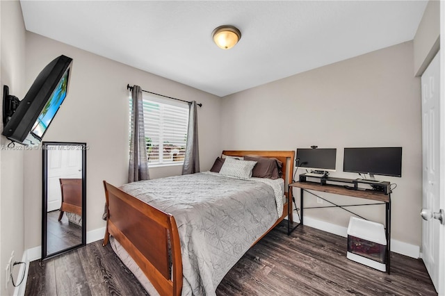 bedroom featuring dark wood-type flooring