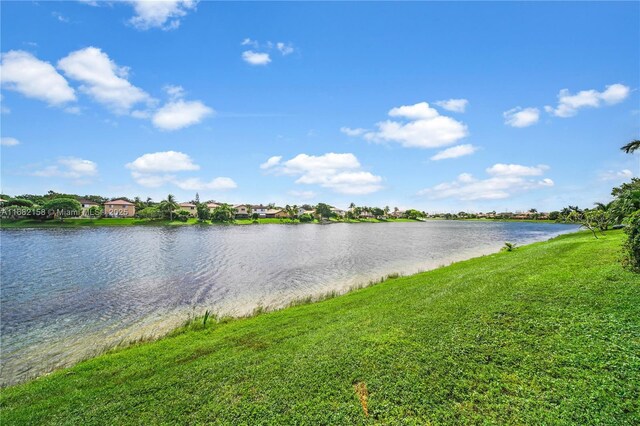 view of yard featuring a patio and a water view