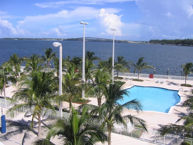 view of pool featuring a water view