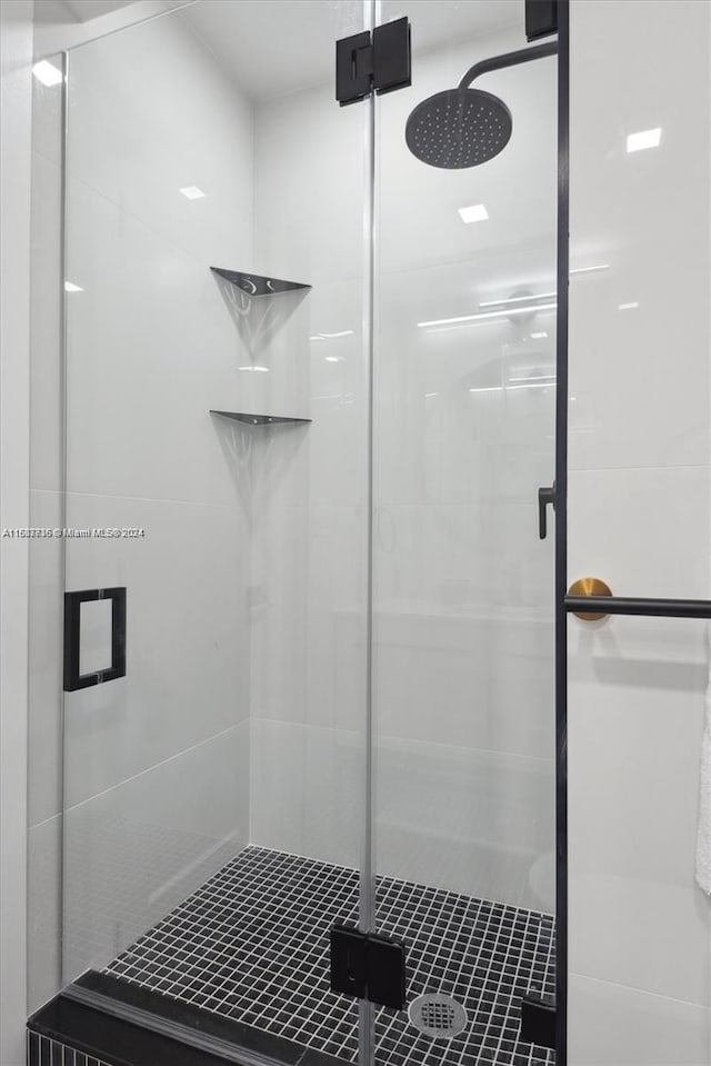 bathroom featuring an enclosed shower