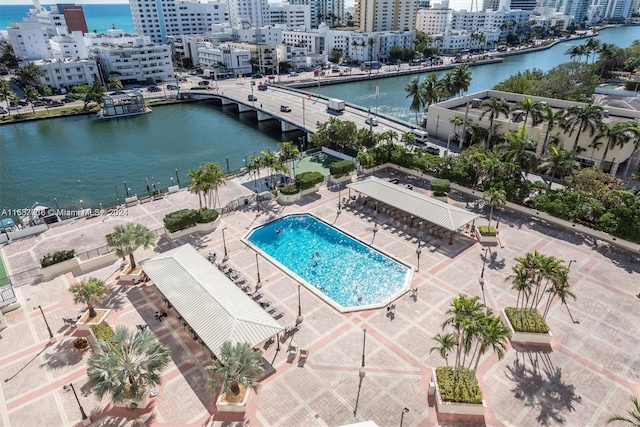 birds eye view of property with a water view