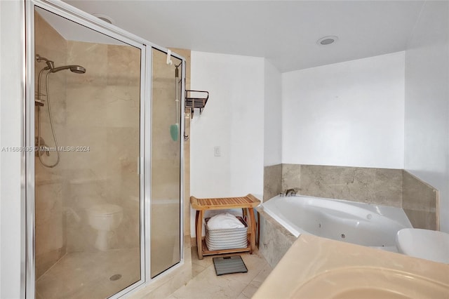 bathroom with toilet, shower with separate bathtub, and tile patterned flooring