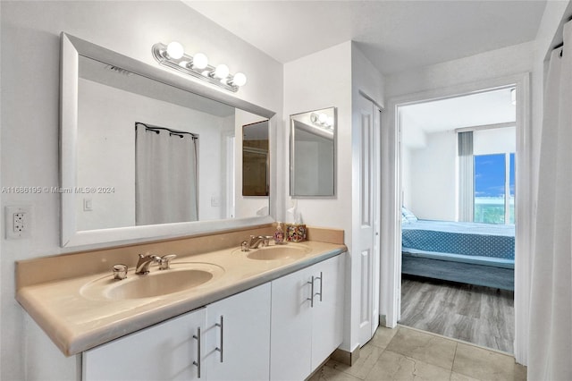 bathroom featuring vanity and wood-type flooring