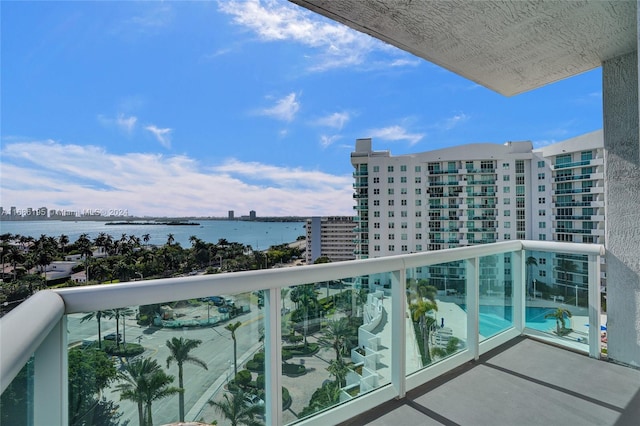 balcony featuring a water view