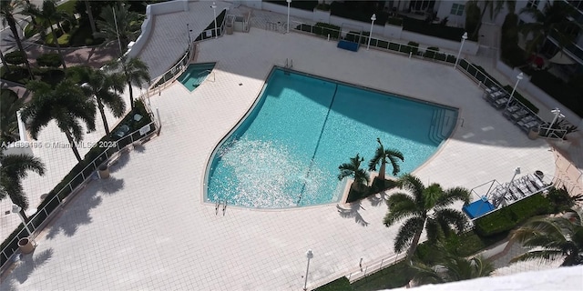 view of swimming pool featuring a patio area