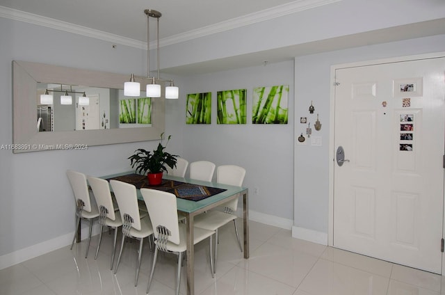 tiled dining room featuring ornamental molding