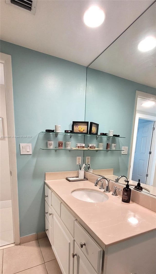 bathroom featuring vanity and tile patterned flooring