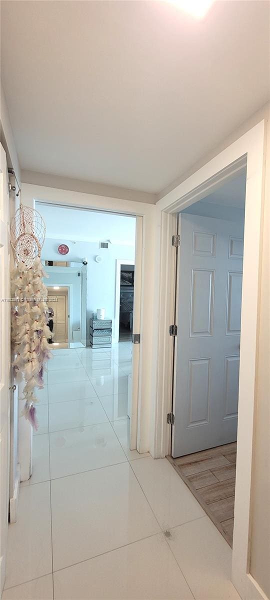 corridor featuring tile patterned floors