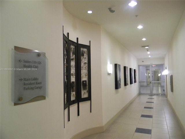 hallway with light tile patterned floors