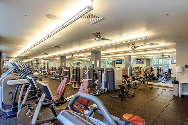 exercise room with ceiling fan