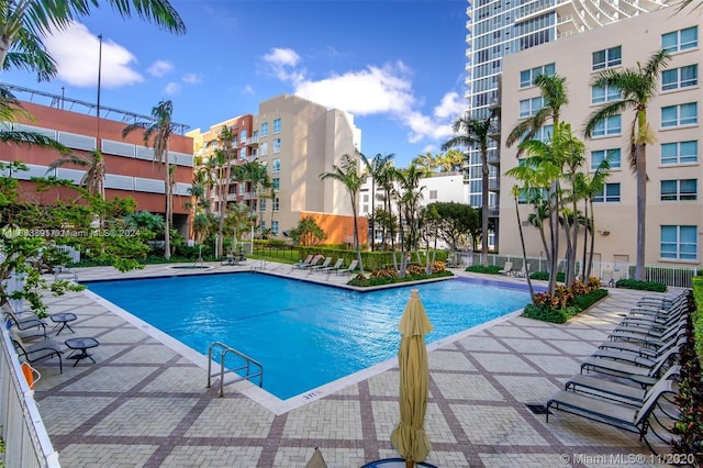 view of swimming pool featuring a patio area