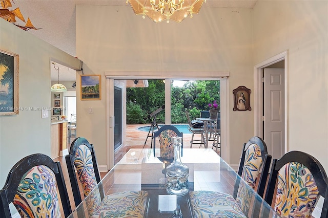 dining area featuring a high ceiling