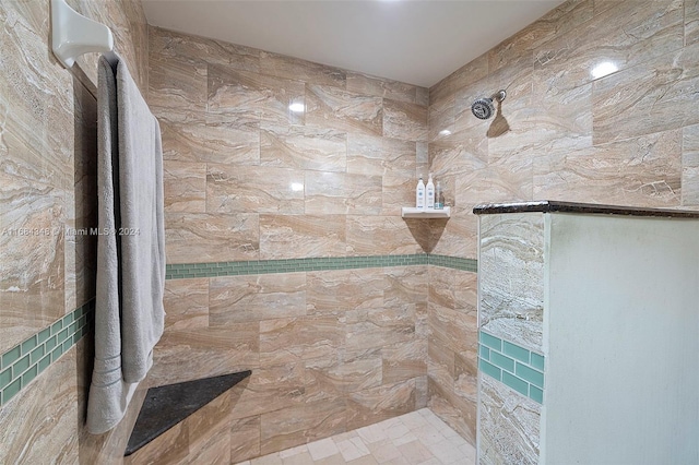 bathroom featuring walk in shower and tile walls