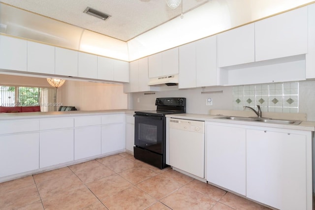 kitchen with sink, dishwasher, premium range hood, and white cabinets