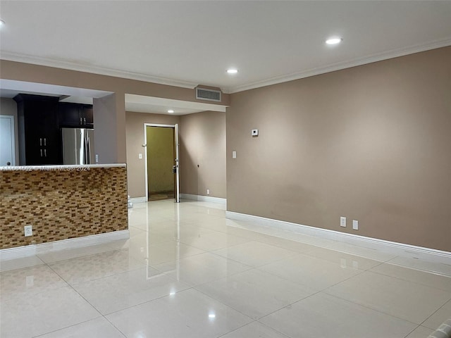 tiled empty room with ornamental molding