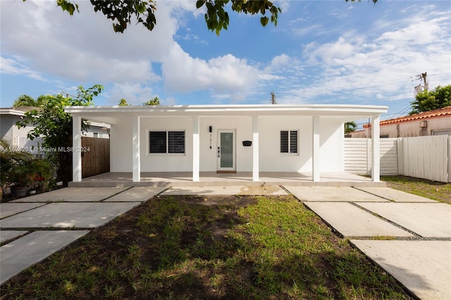 view of front facade with a carport