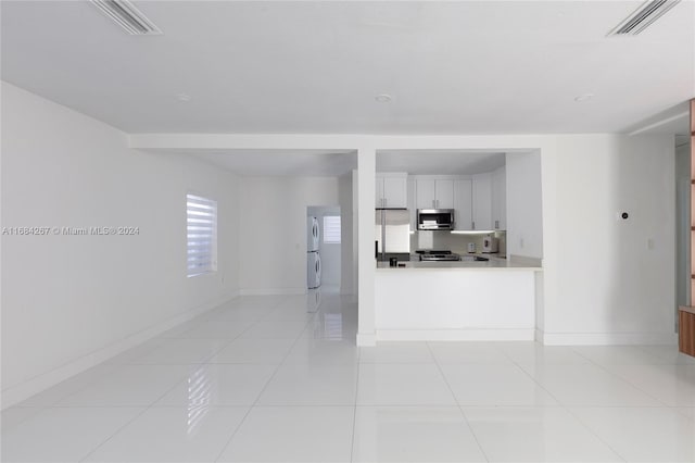 living room with light tile patterned flooring